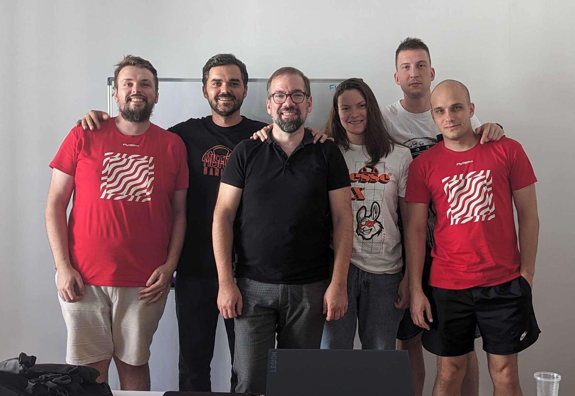 Group photo of the FWRD Digital & Product creative team standing together in their office workspace.